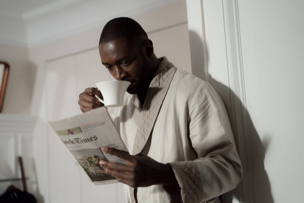 bathrobe with morning paper and coffee